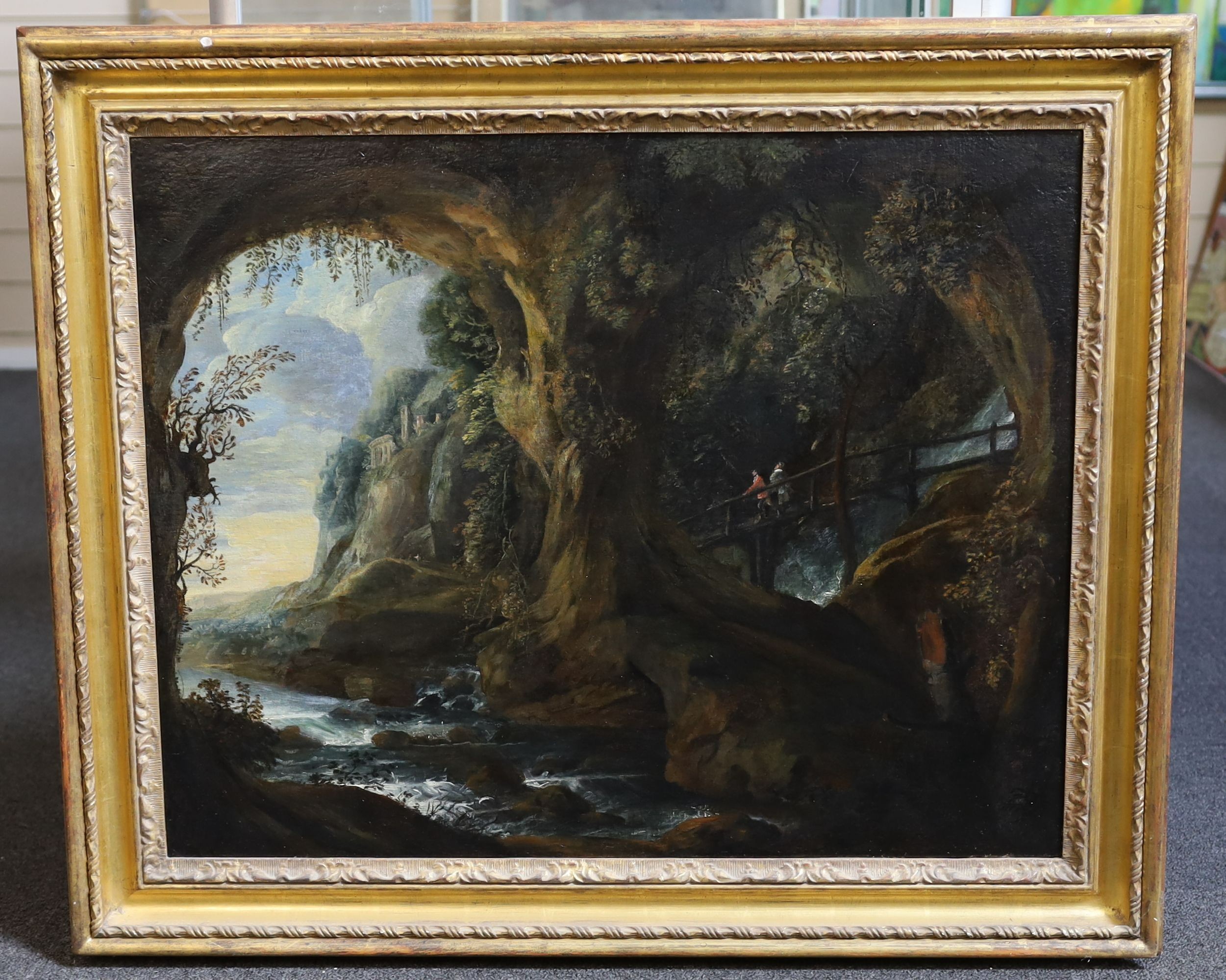 Early 19th century Italian School, Travellers looking out from a grotto, oil on canvas, 57 x 71cm